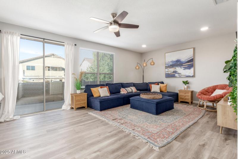 Large den upstairs with patio