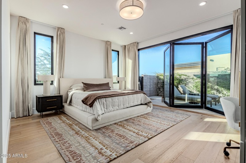 Bedroom with wall of glass