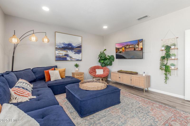 Large den upstairs with patio