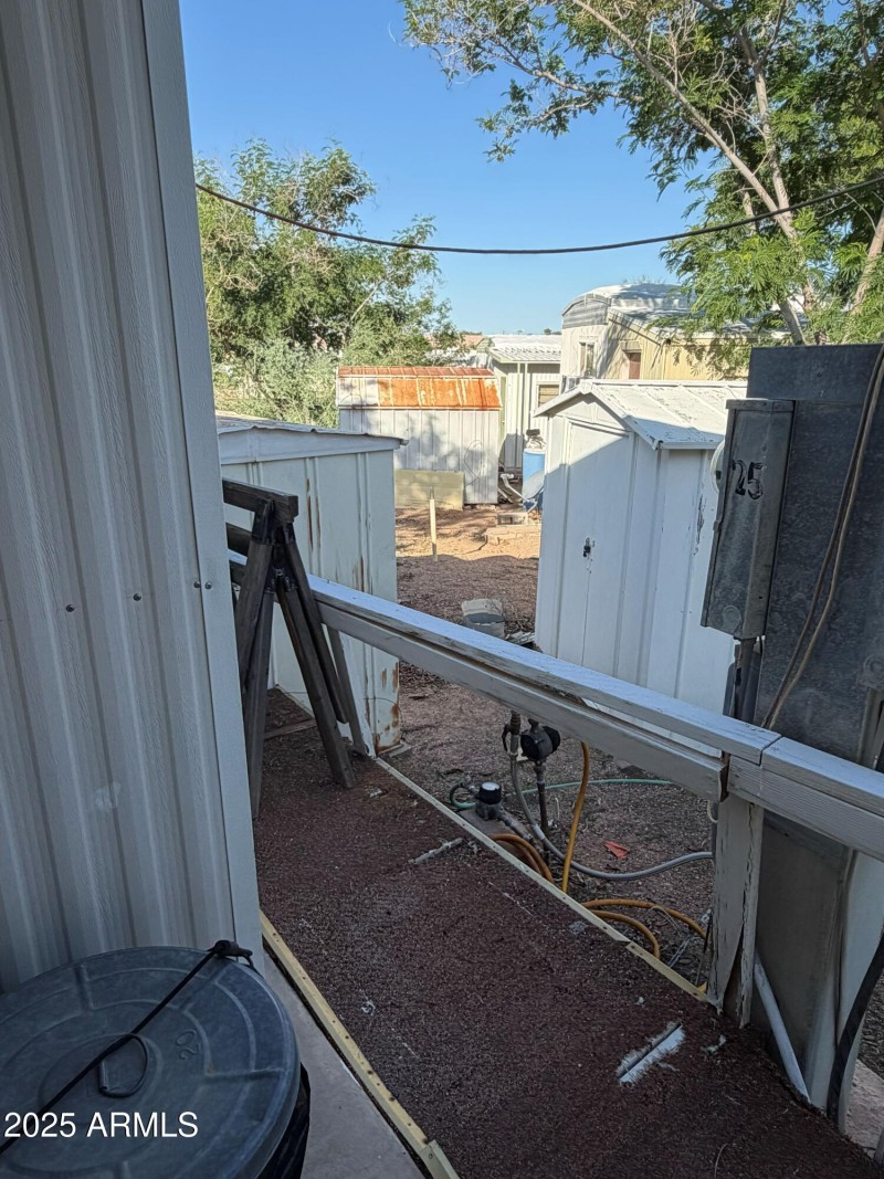 2 separate little storage sheds