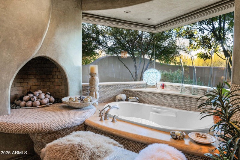 Primary Bathroom Tub with Fireplace