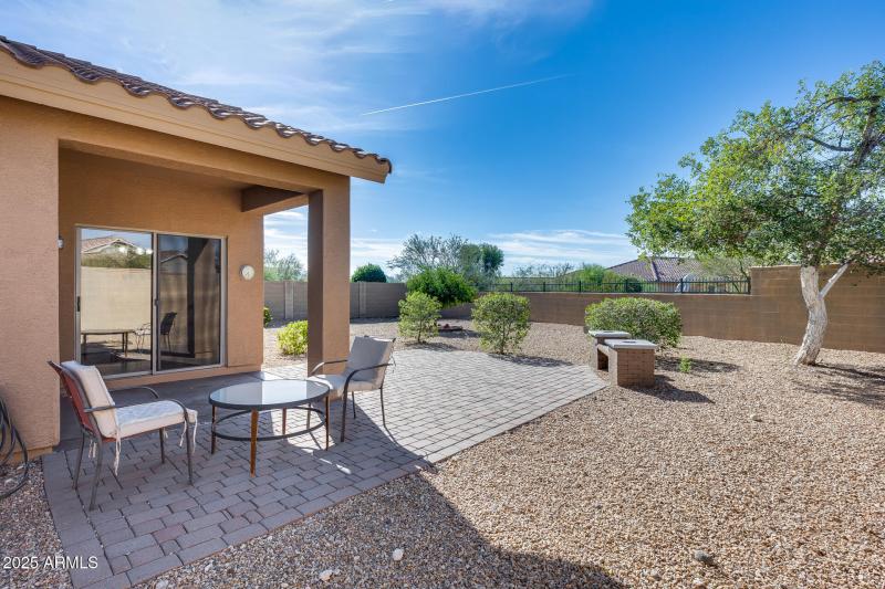 Covered patio and yard with view fence