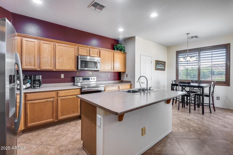Kitchen with breakfast bar and dining
