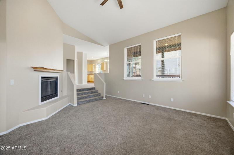 Sunkin living room with gas fireplace