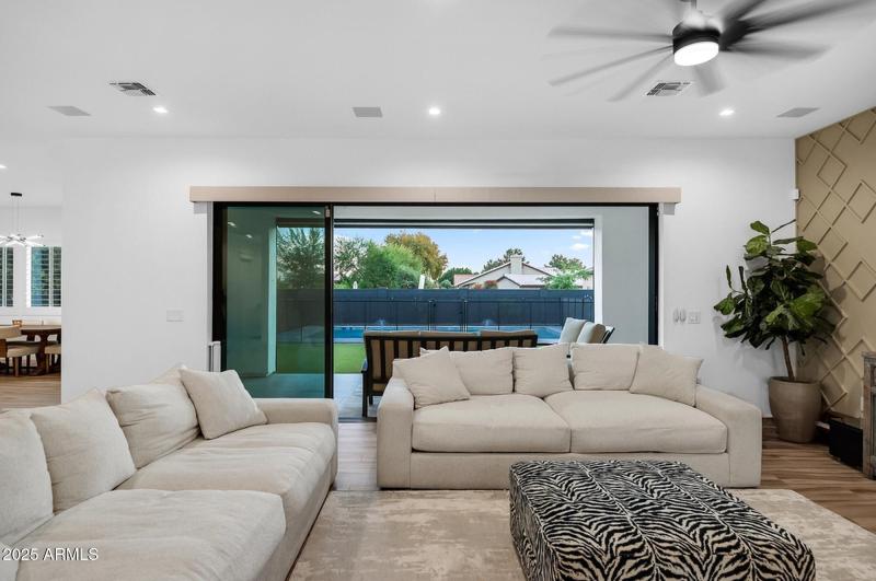 TRIPLE SLIDING DOORS TO THE BACK PATIO