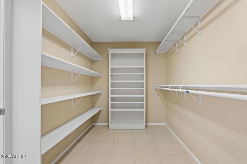 Primary Closet with shelving