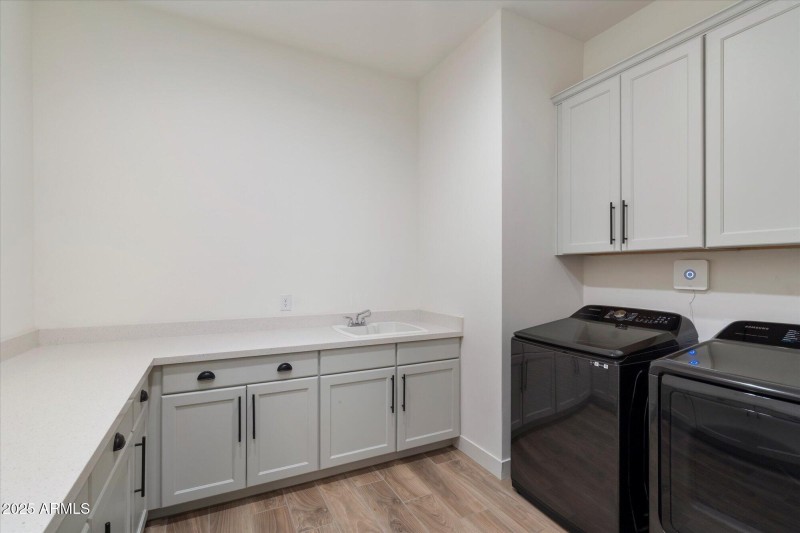 laundry w sink and tons of storage