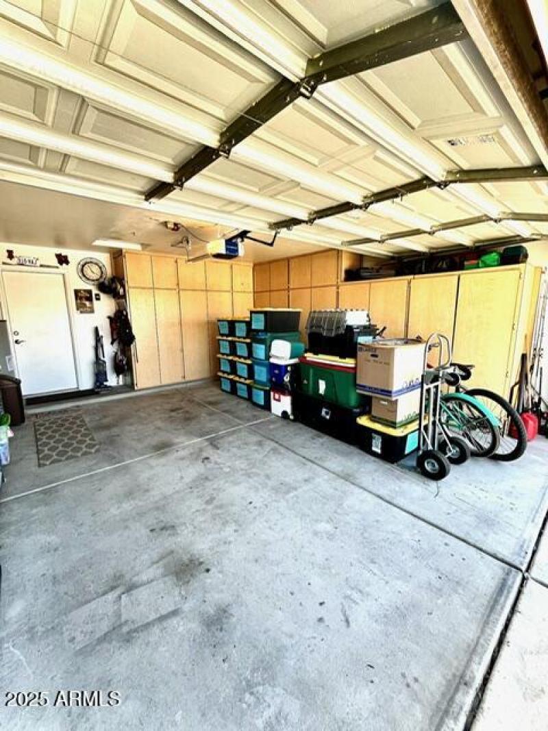 2-car garage with cabinets and soft wate