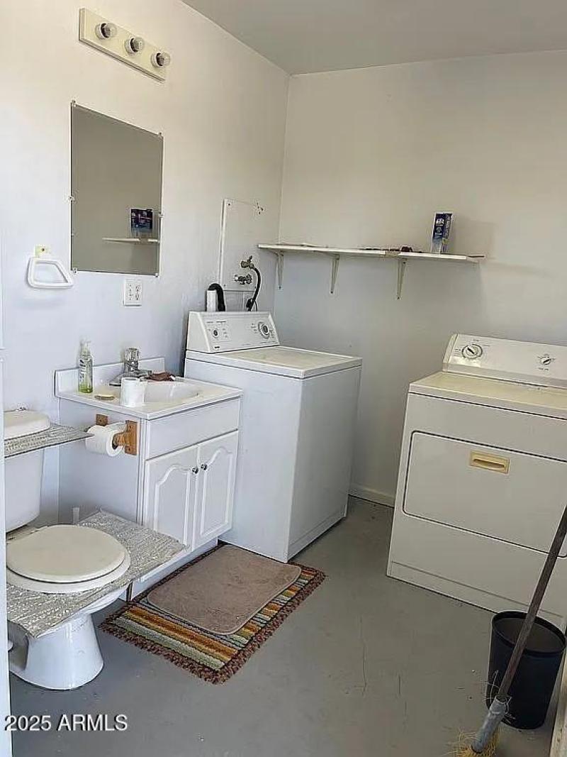 another view of washer dryer toilet