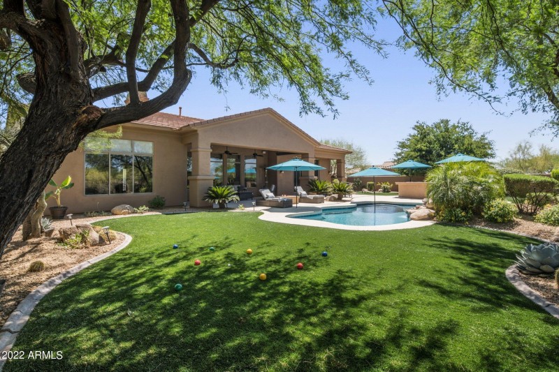grassy yard and pool