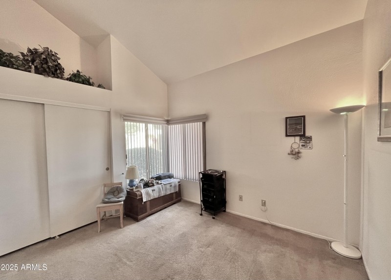 bedroom 2 with vaulted ceiling