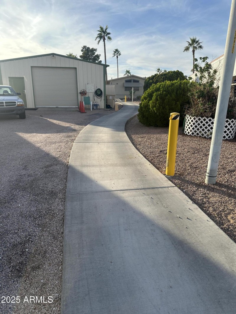 sidewalk to pool/spa area