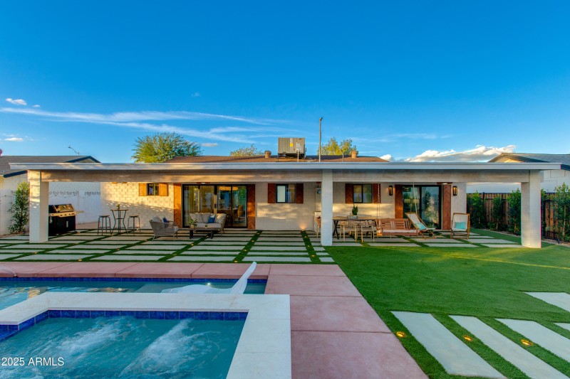 VIEW OF THE HOME FROM THE POOL