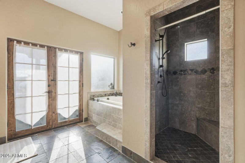 French doors to covered patio and pool