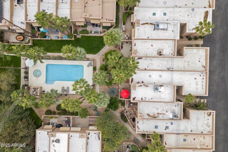 Drone view of community pool and roof