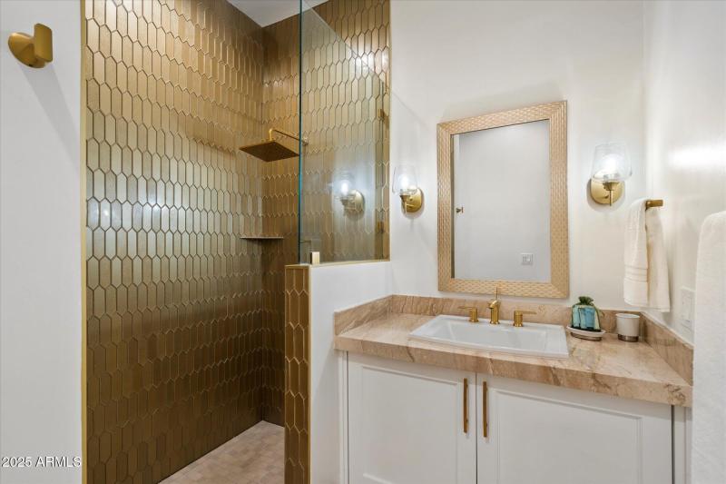 Modern Bath with Metallic Accents