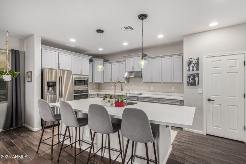 GOURMET KITCHEN WITH WALL OVENS & SEPARA