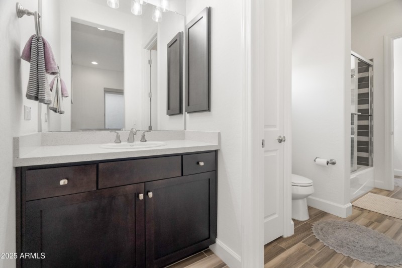 private sink area opens to shared bath