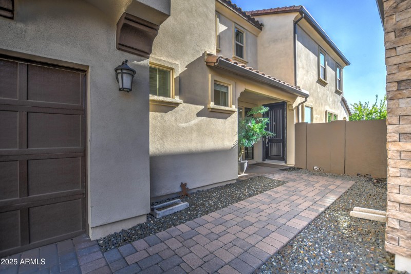 Paver sidewalk to large open Entry