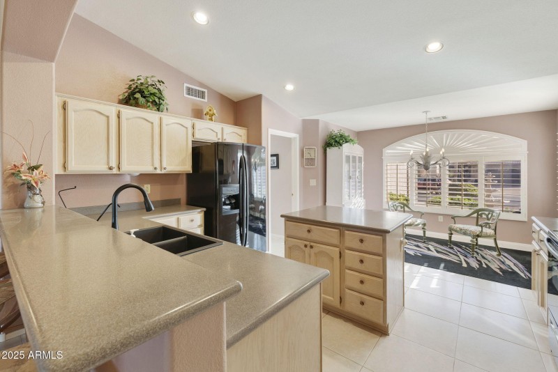 Kitchen with island and breakfast bar
