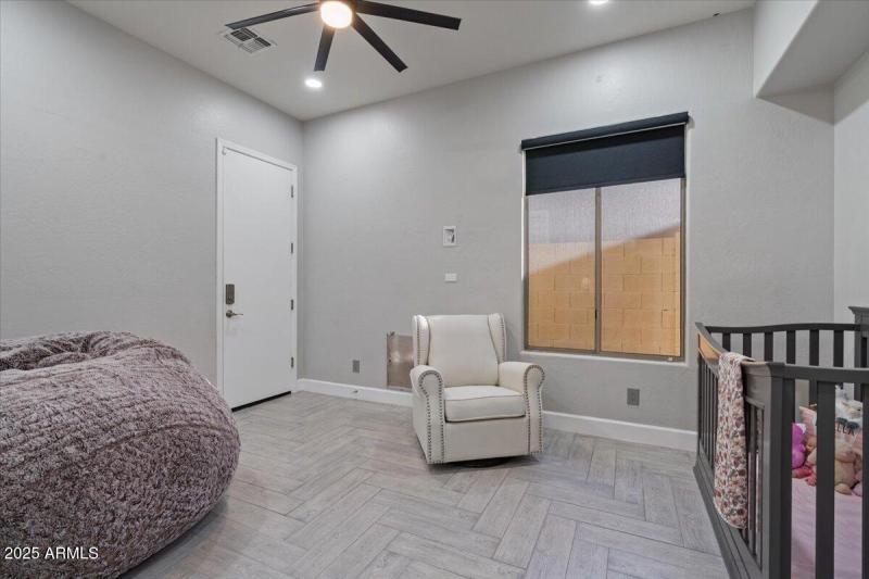 Den with garage entrance