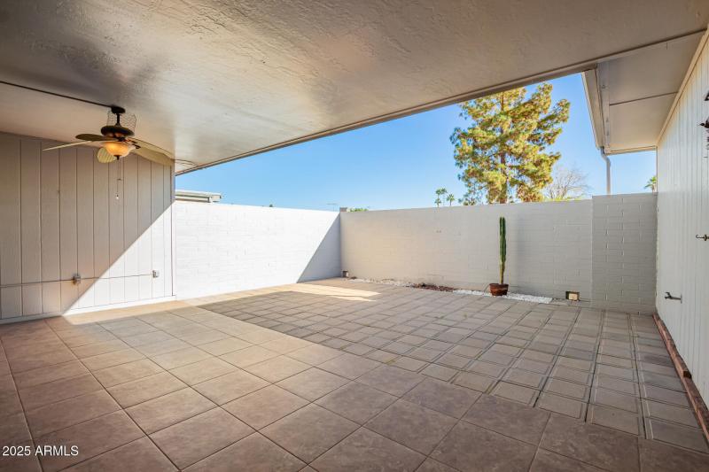 Tiled Covered Patio with Fan.