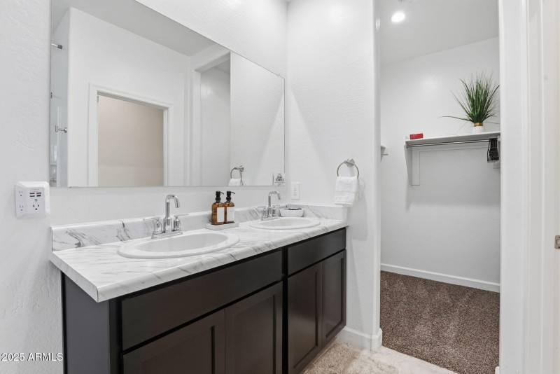 Master bath has double sinks and extra l