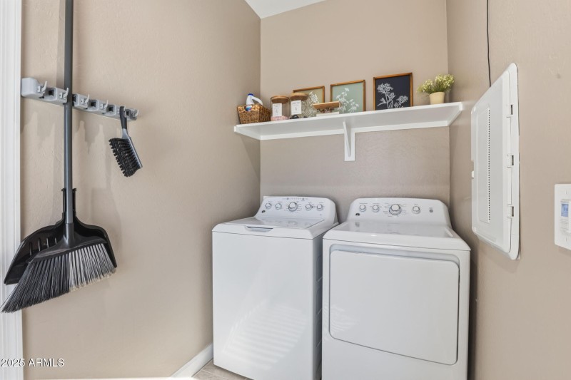 Washer and dryer next to garage