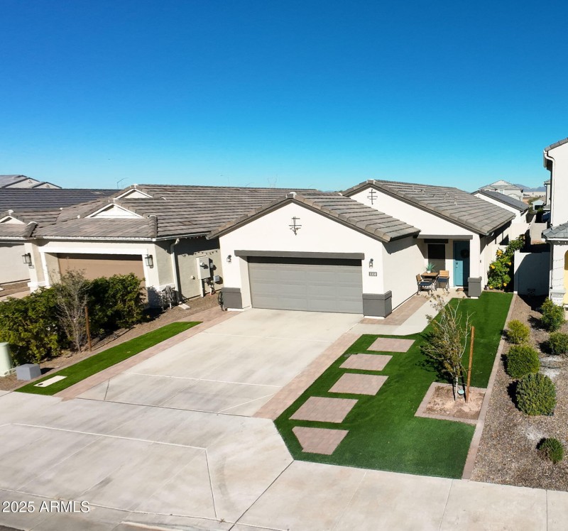 Artificial grass and pavers in front yar