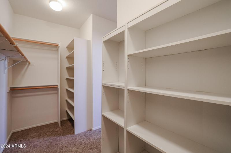 Primary bedroom closet 1