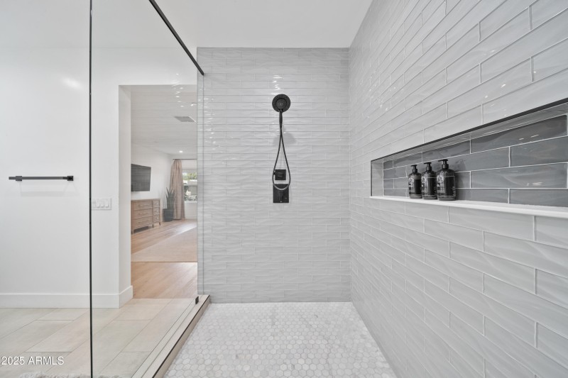 Floor to ceiling glass & tile shower