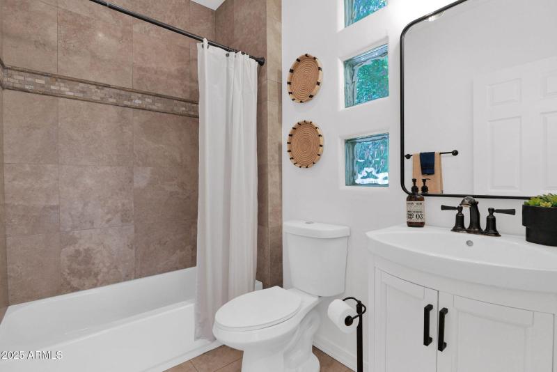 one of two full baths downstairs