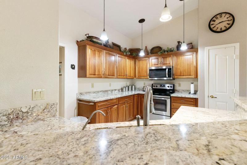 Kitchen w/granite and cherry cabinets