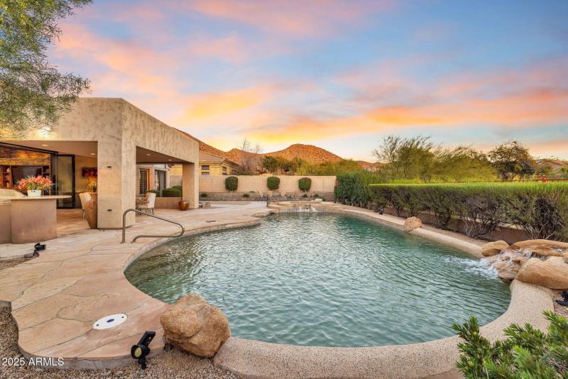 WATERFALL INTO SPARKLING POOL