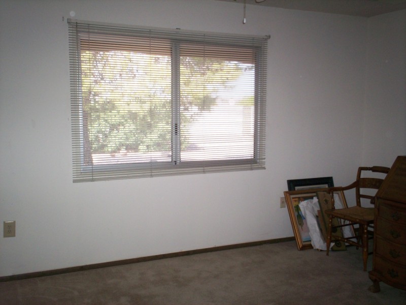 master bedroom w/ view to back yard
