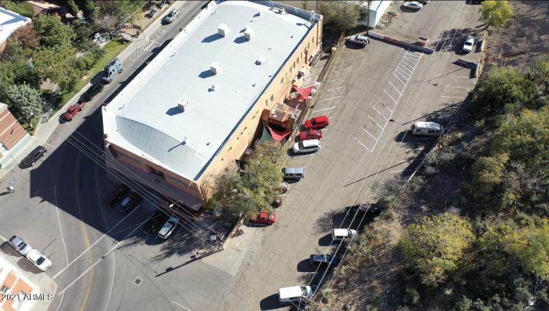 OVERHEAD DRONE OF BUILDING AND PARKING