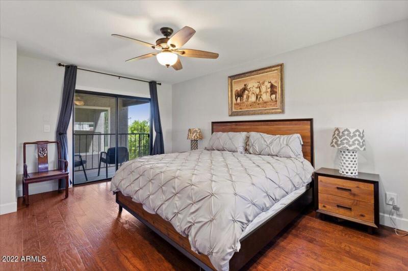 Bedroom with balcony and king size bed