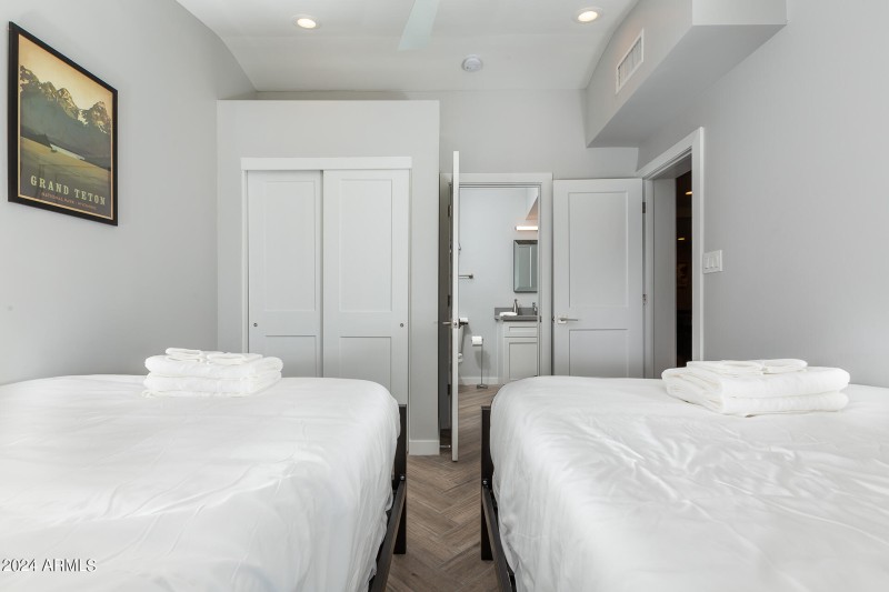 Bedroom-With-Two-Beds-and-Bathroom