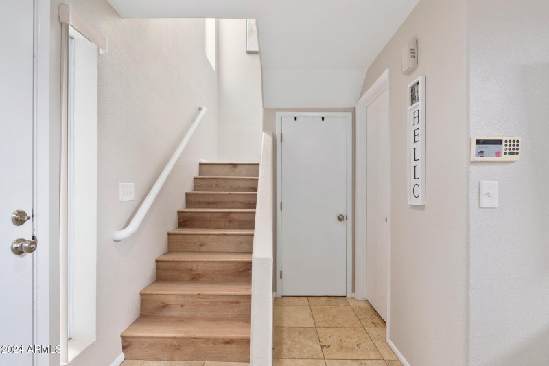 Stairs and half bath to the right