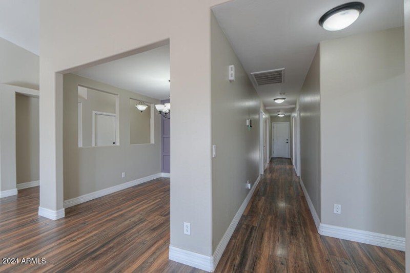 Hallway to 3 bedrooms and full bath