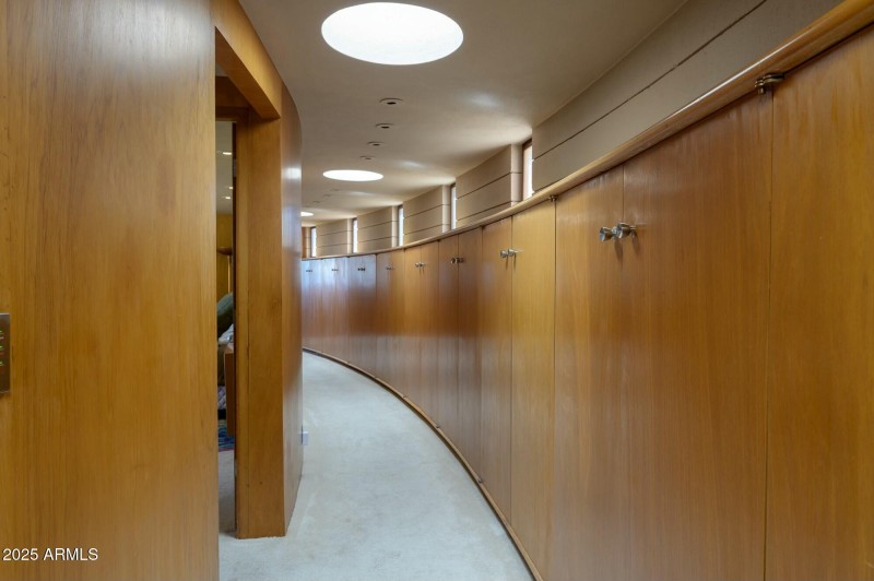 Hallway with extensive cabinetry
