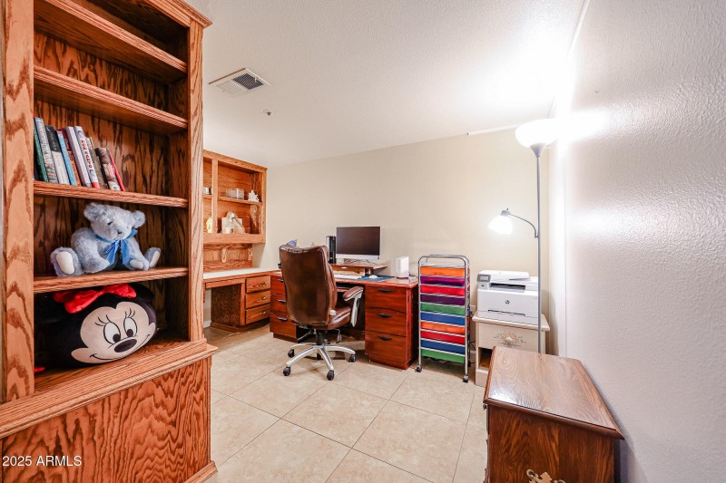 Den with added oak cabinetry