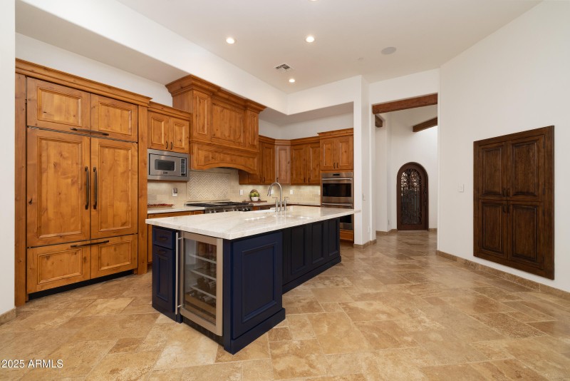 Kitchen withbeverage refrigerator.