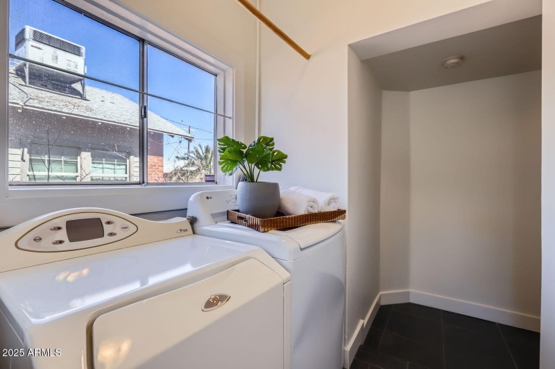 Laundry room with hall to primary suite