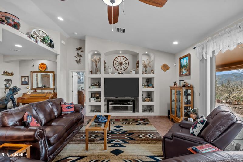 Entertainment Center holds a 65" TV