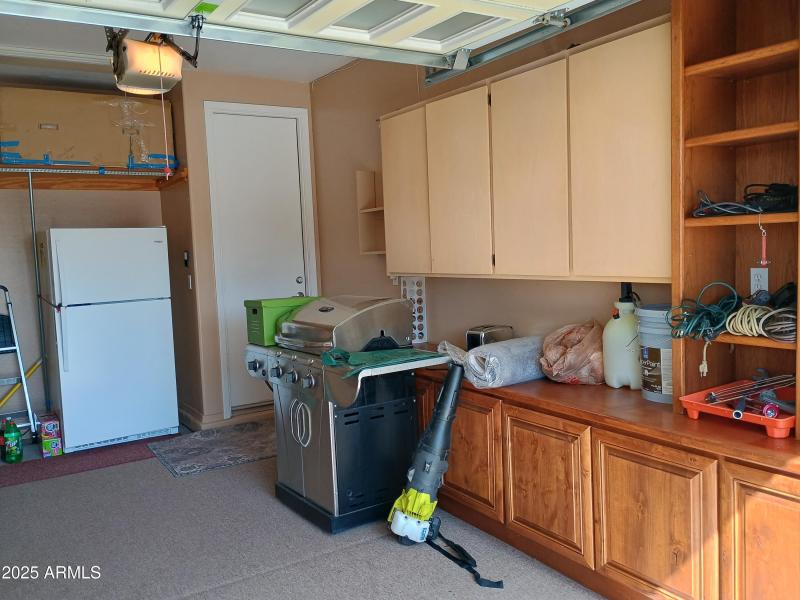 31_Golf Cart Garage Has Cabinets