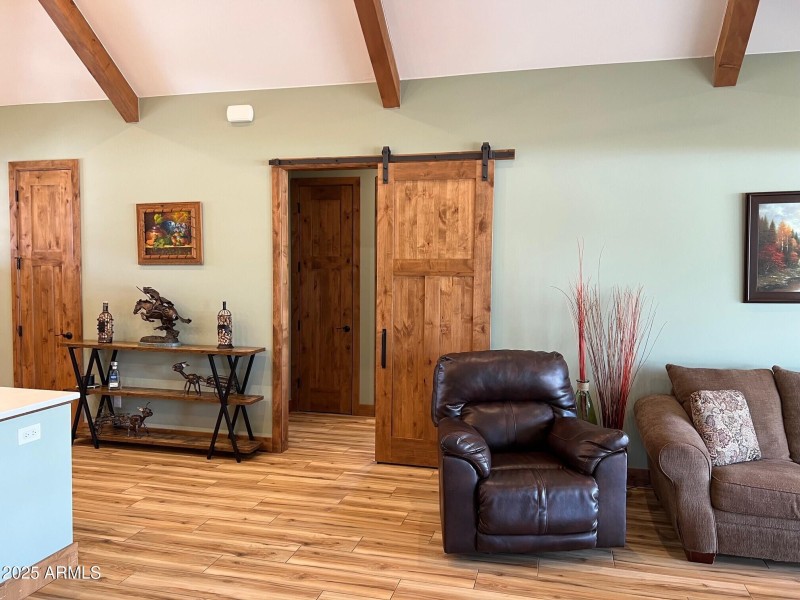 Barn door to secondary bedrooms and gues