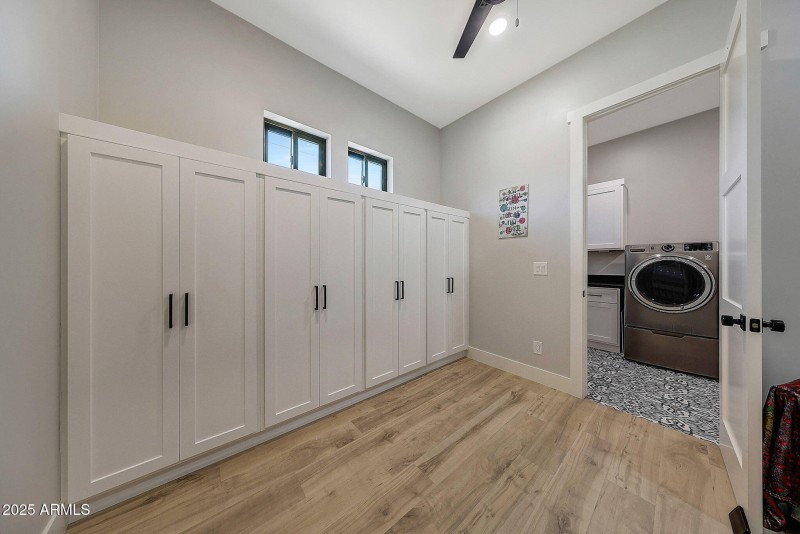 Part of the primary bedroom closet that