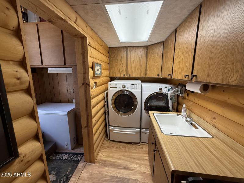 Laundry area with utility sink