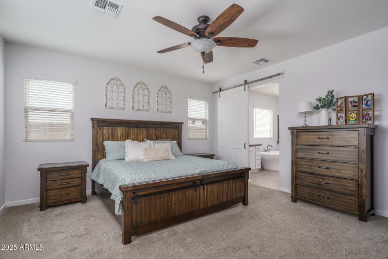 11) PRIMARY BEDROOM